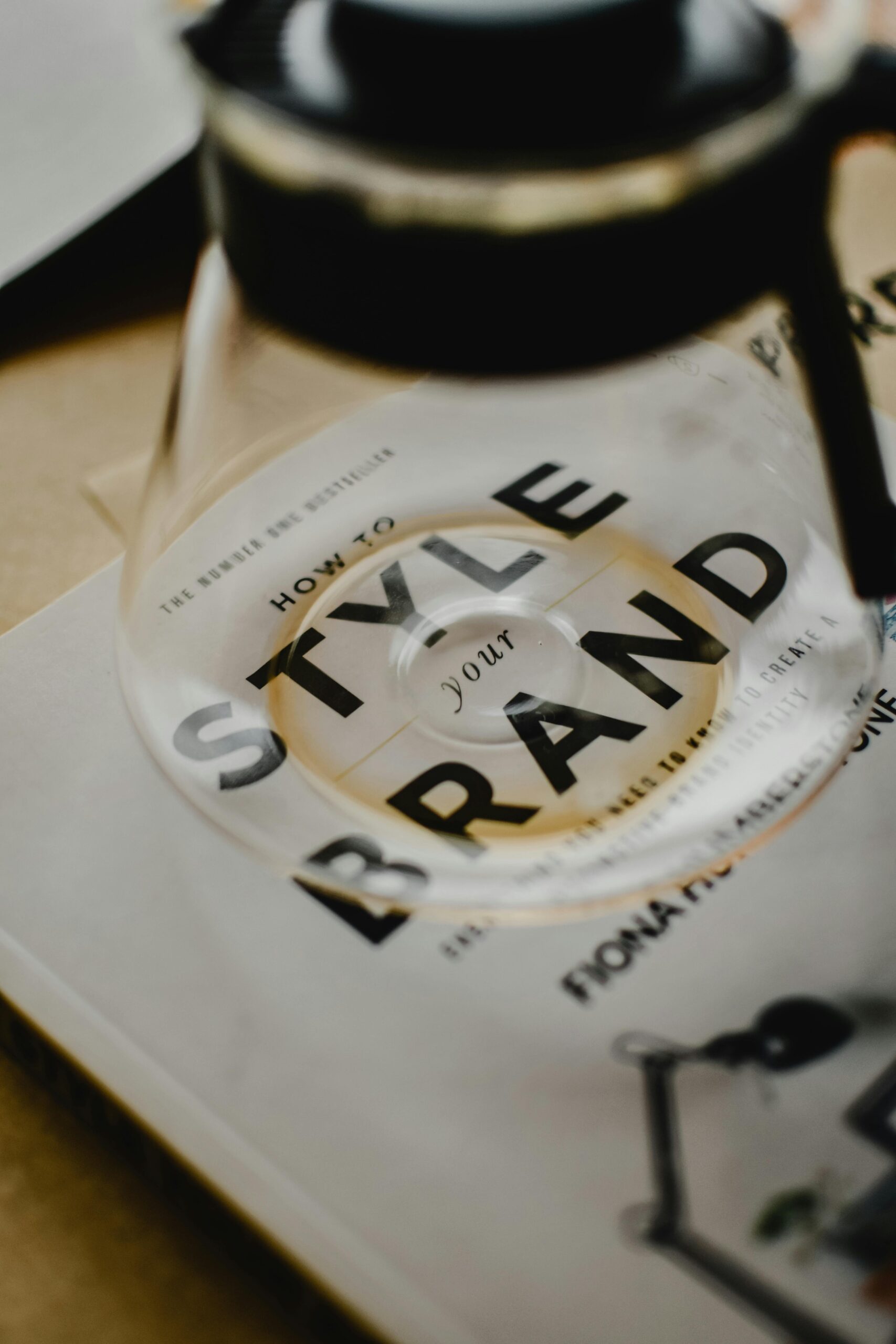 A coffee pot rests atop a book titled 'How to Style Your Brand', best digital marketing strategist in calicut capturing the essence of creative branding.